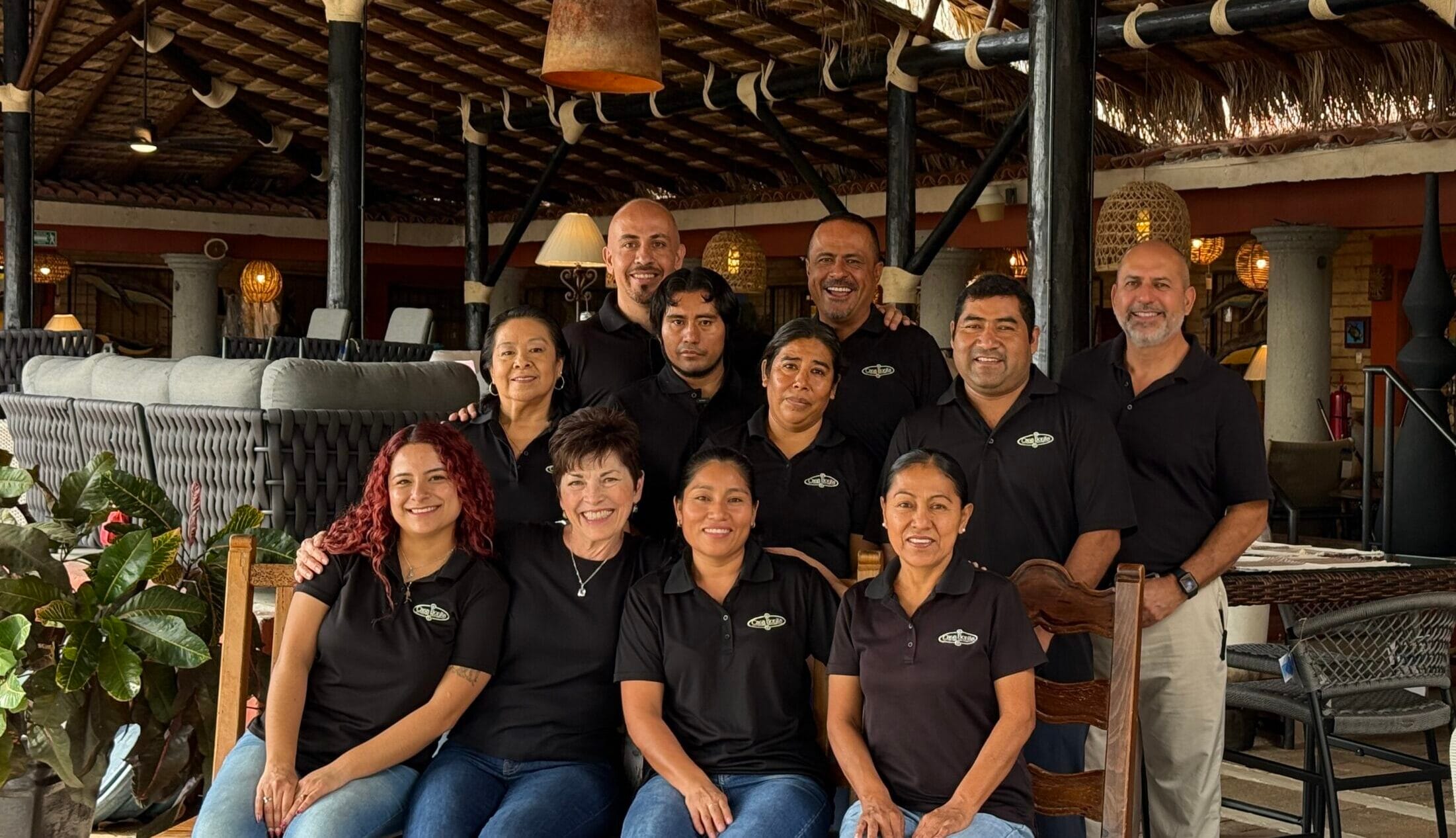 The Casa Bonita team gathered together under the showroom's thatched roof