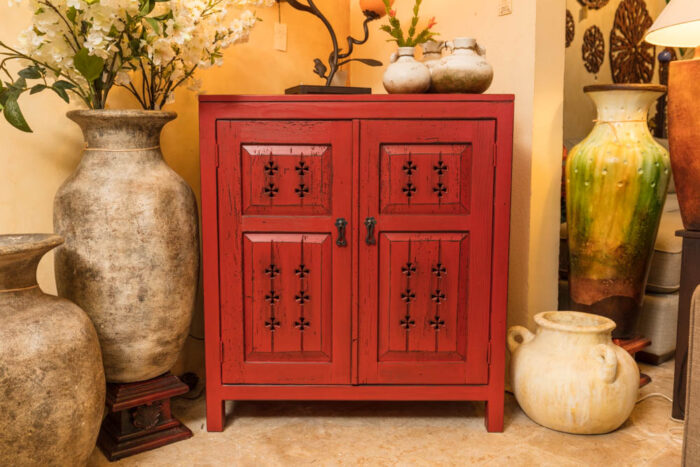 Armario Cruces Rojo Red wormwood dresser with carved details at furniture store in Cabo San Lucas Mexico