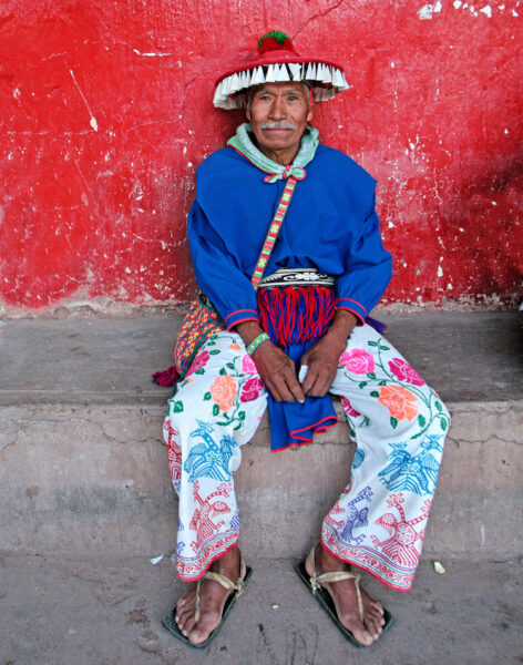 Bruce Herman Huichol Caminando Bruce Herman photograph of old man sitting on sidewalk