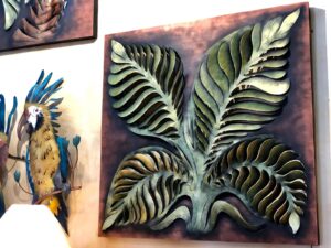 Large metal wall art of a plant with four leaves