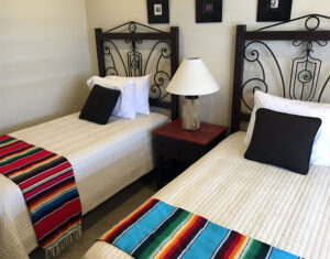 Black twin bed frames with iron details, made in Mexico and sold in Cabo San Lucas