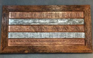 Hammered copper and aluminum wall art with wooden frame