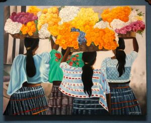 Painting of Mexican women holding baskets of flowers above their heads, in Cabo San Lucas