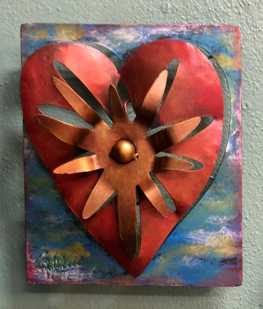 6F67B87B-E2DD-4390-BA2F-EAE3578CEFF7 Metal Art Piece Of a Heart with a Sun