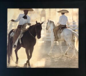 Bruce Herman photograph of Mexican cowboys riding horses
