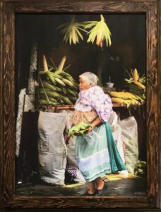 Bruce Herman photograph of elderly Mexican woman at corn stall