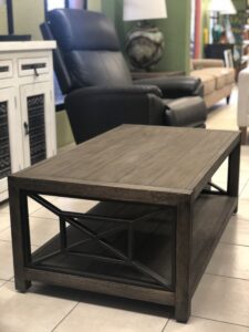 Wooden rectangular coffee table with metal details at furniture store in Cabo San Lucas