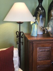 Iron floor lamp with decorative details and lampshade