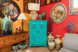 Turquoise Mexican wormwood cabinet with carved details and metal handles