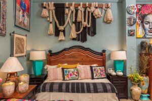 Bed and bed frame with hand embroidered bedding and pillows at Casa Bonita