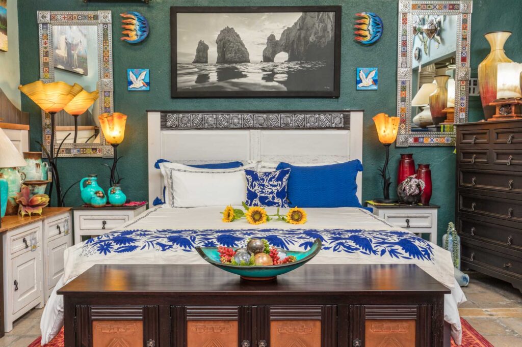 Bed with DUES bedding and pillows Bed and bed frame with hand embroidered bedding and pillows at Casa Bonita