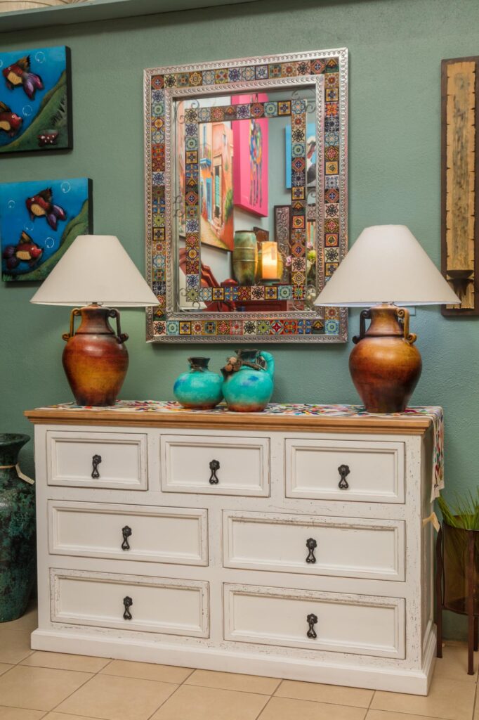 Bedroom dresser Bed and bed frame with hand embroidered bedding and pillows at Casa Bonita
