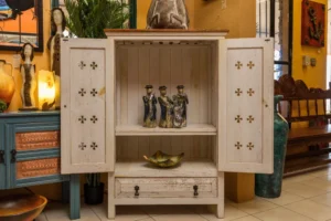 White wormwood cabinet with carved details, two shelves, and a drawer