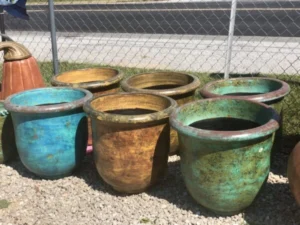 Authentic Mexican handcrafted outdoor pots in blue, brown, and teal