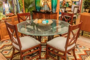 Round crackled glass dining room table with modern chairs, sold in Cabo San Lucas