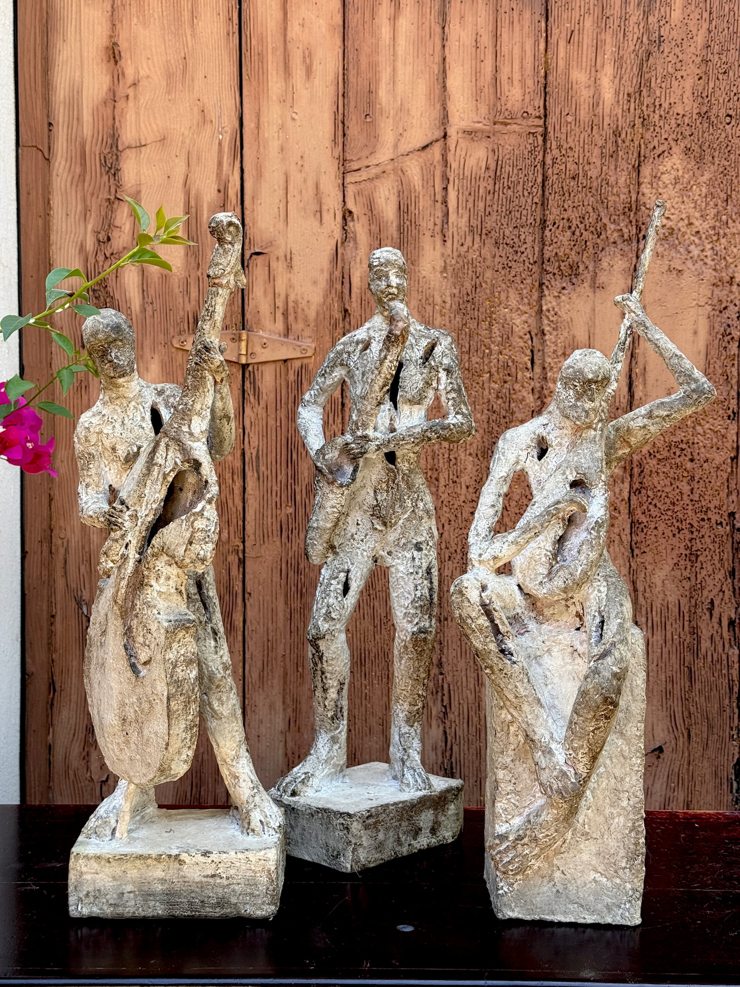 Decorative clay musician sculptures with a weathered finish