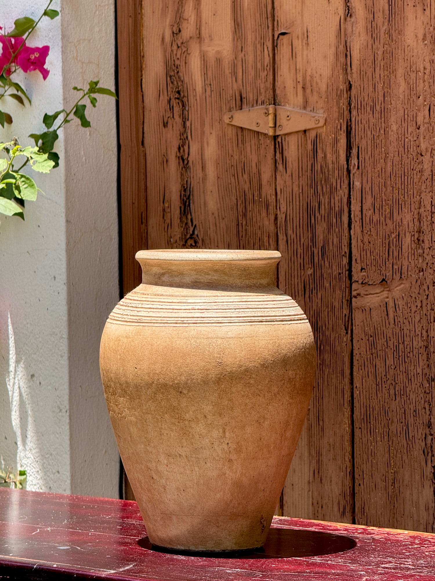 Decorative clay vase with a weathered finish