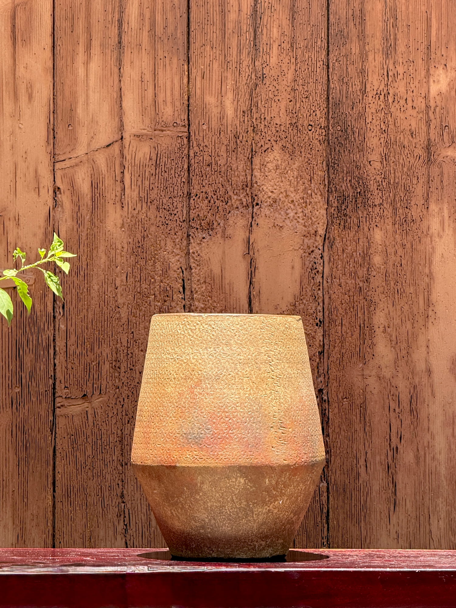 Decorative clay vase with a weathered finish