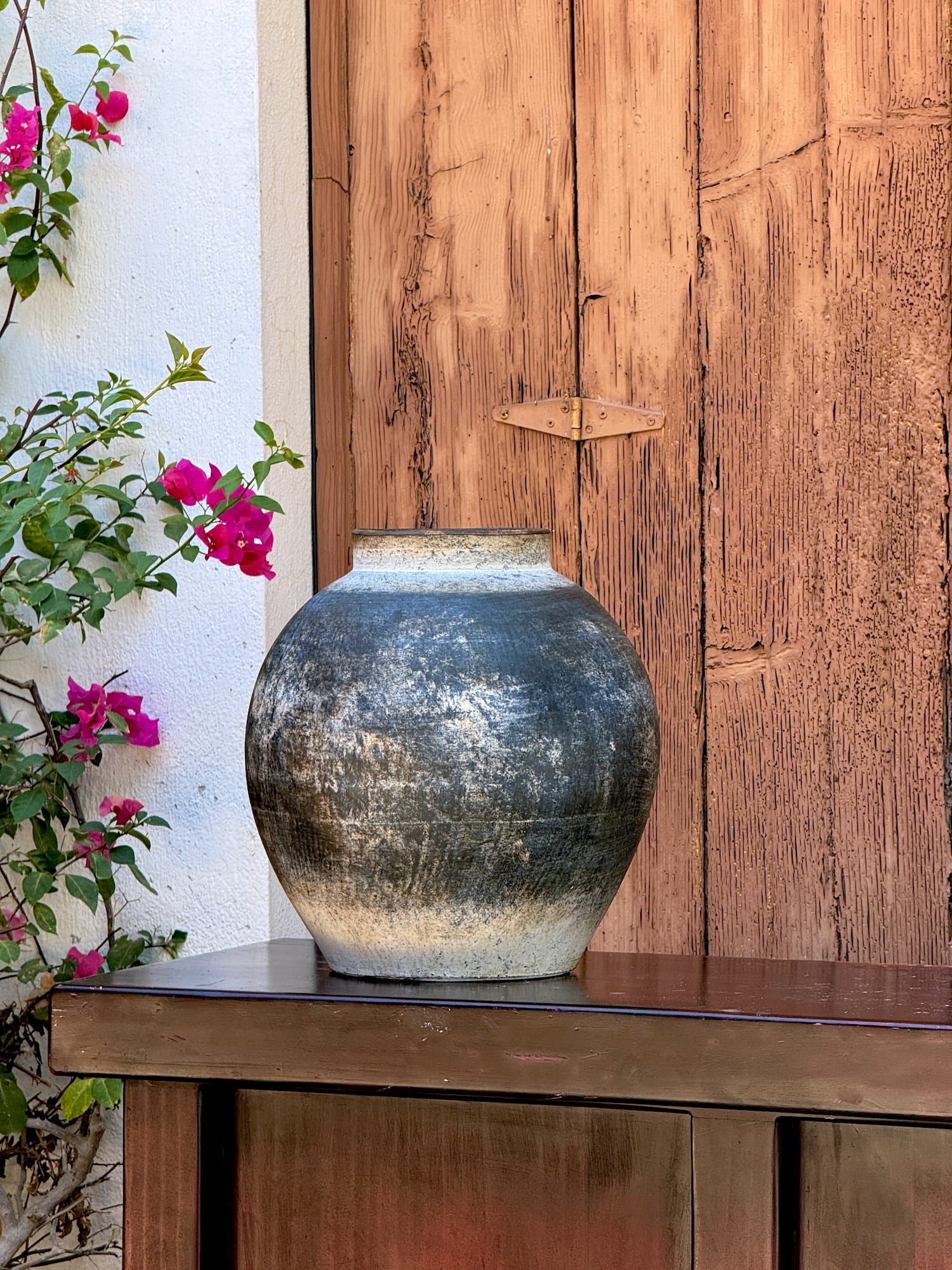 Round clay vase with weathered finish