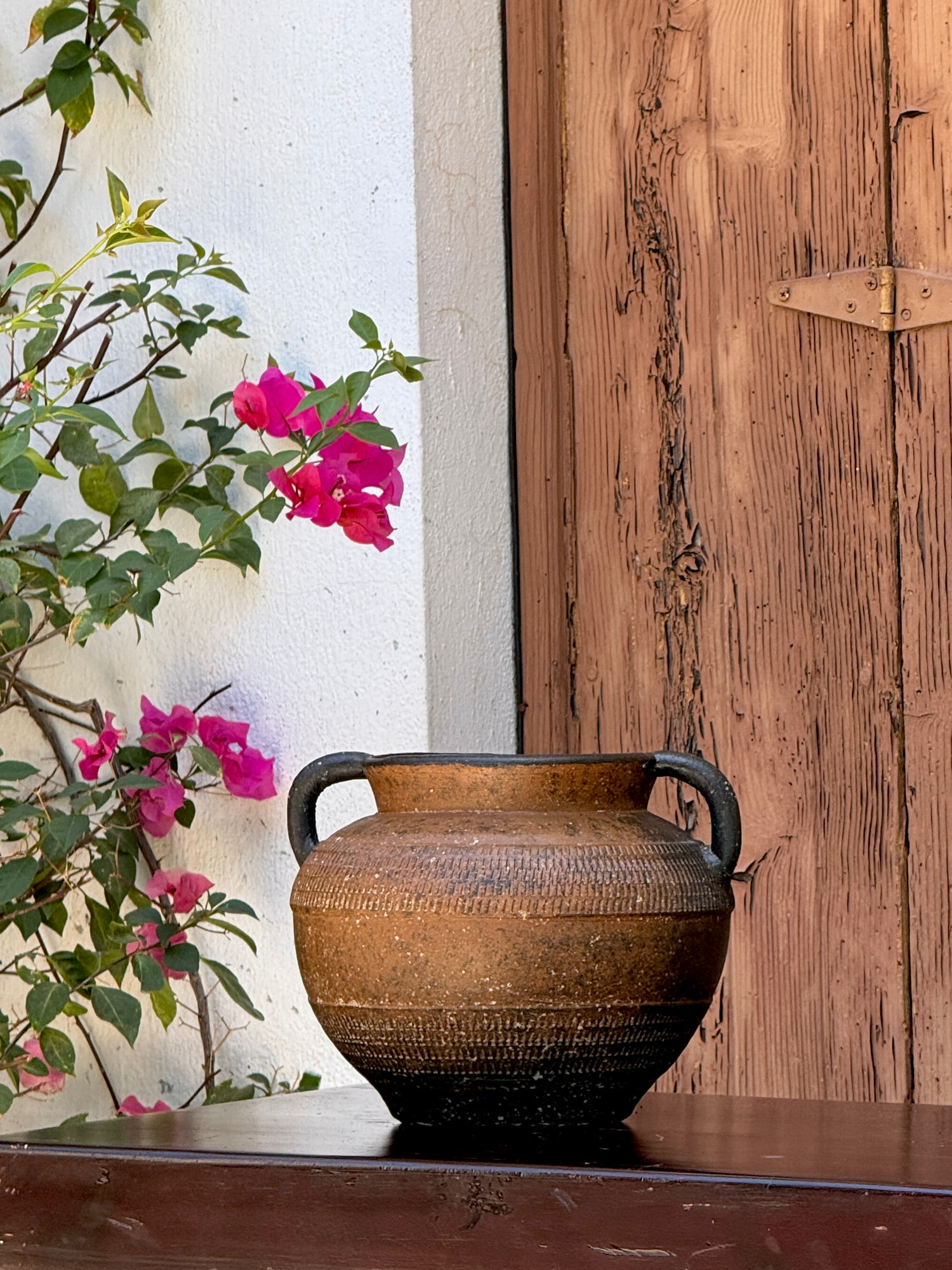 Decorative clay vase with weathered finish