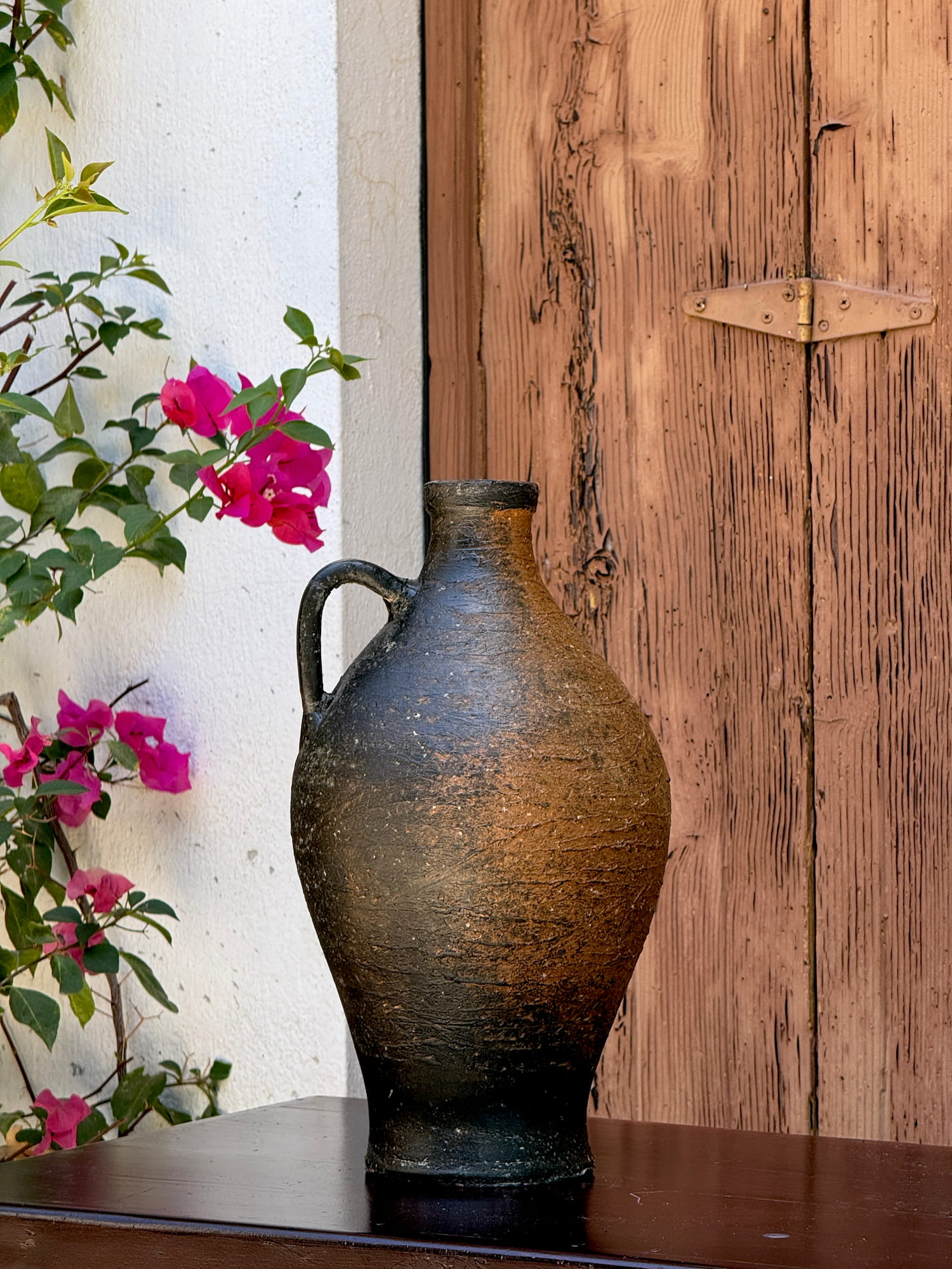 Decorative clay vase with weathered finish