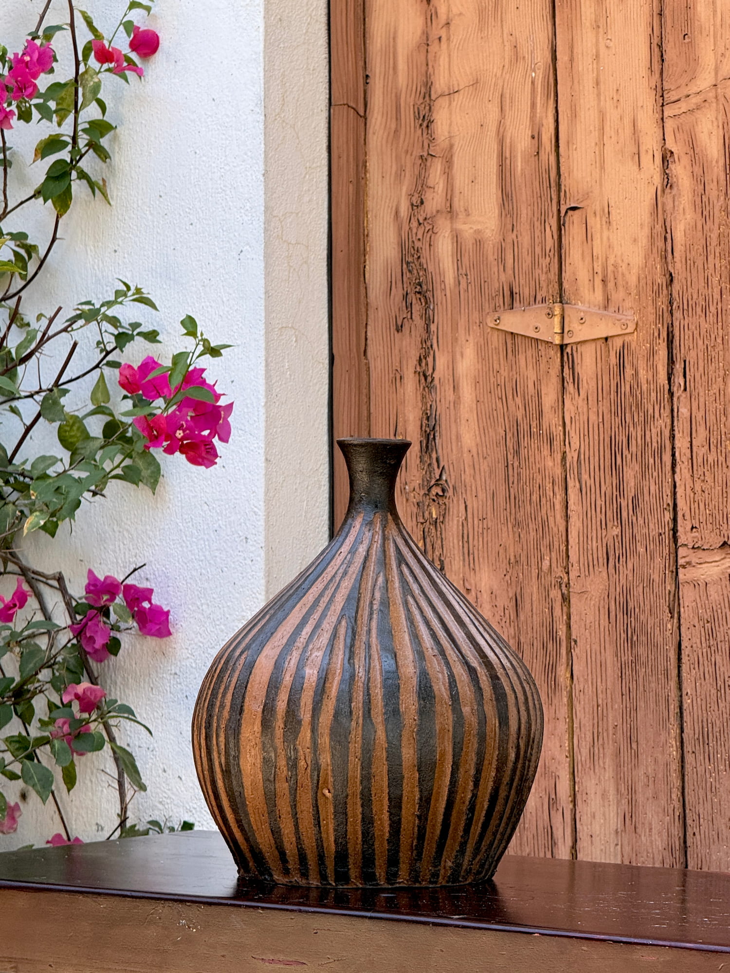 Decorative clay vase with weathered finish